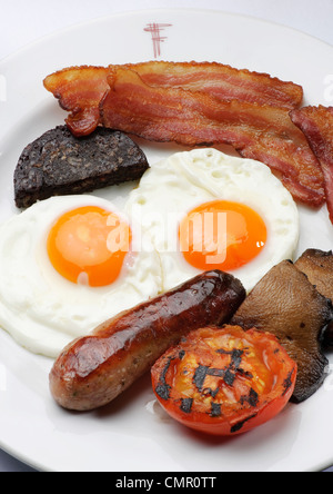 full English breakfast fry up egg and bacon restaurant unhealthy food greasy spoon Stock Photo