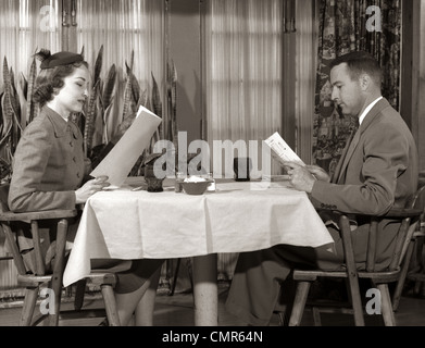 1950s COUPLE MAN WOMAN READING RESTAURANT MENUS