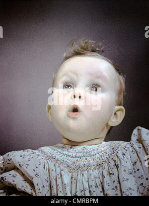 1940s 1950s PORTRAIT BABY CUTE FACIAL EXPRESSION OF AWE WONDER SURPRISE Stock Photo