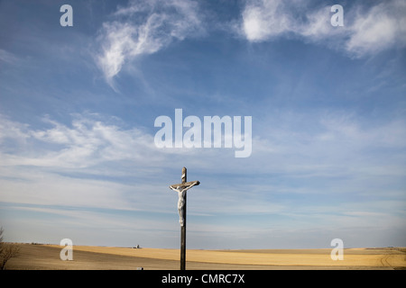 Large crucifix in a Catholic cemetery, next to wheat fields, Prelate, Saskatchewan Stock Photo