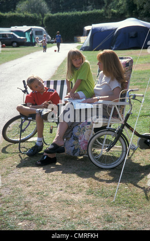 mum and two children camping Stock Photo