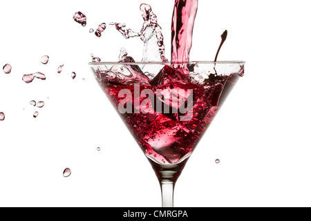 Red drink poured with a splash of ice cube on white background Stock Photo