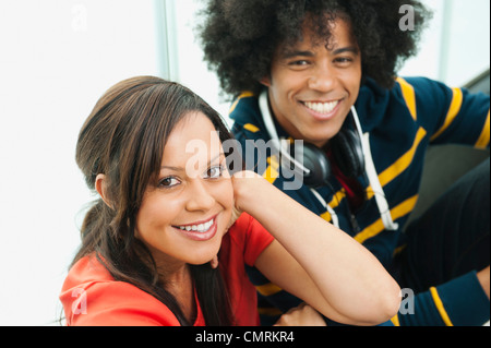 Smiling couple sitting together Stock Photo