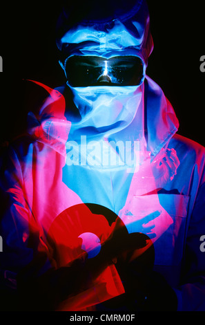 DOUBLE EXPOSURE OF LAB WORKER IN CLEAN ROOM GEAR Stock Photo