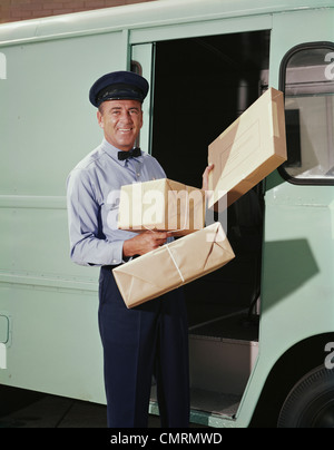 DELIVERY TRUCK DRIVER PACKAGES BOWTIE CAP BOXES RETRO 1950 1950s Stock Photo