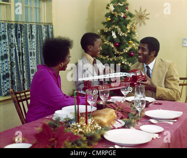 1970s AFRICAN-AMERICAN FAMILY MOTHER FATHER GIRL DAUGHTER PLAING ON ...