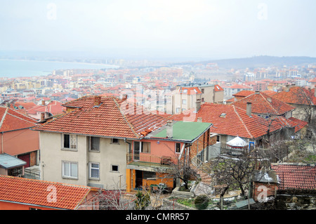 Rooftop view of small seaside town in a foggy day Stock Photo