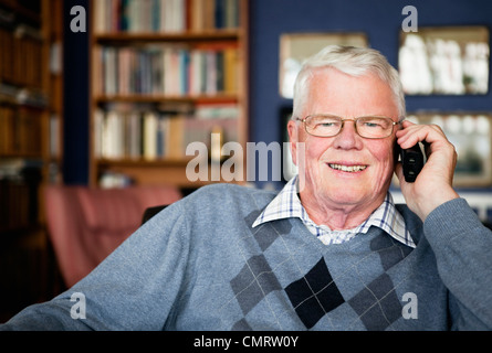 Elderly man talking on the phone Stock Photo