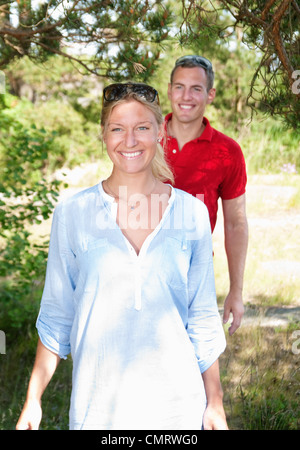 Two people walking in the woods