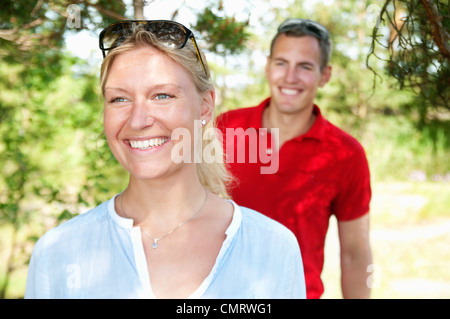 Woman and man walking in the woods