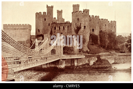 1923 Conway Castle suspension bridge over the estuary Stock Photo
