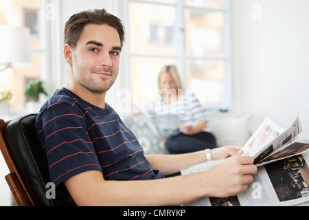 Man reading magazine Stock Photo