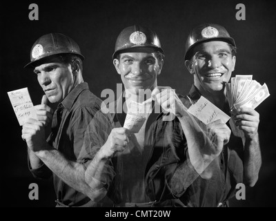 1950s 1960s GRAPHIC EFFECT TRIPLE EXPOSURE SHOWING MAN HARDHAT WORKER READING PAY ENVELOPE OPENING IT SHOWING CASH SMILING Stock Photo