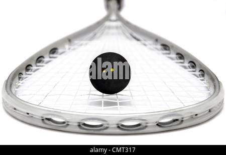 Close up of a squash racket and ball over white Stock Photo