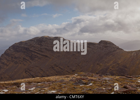 The bealach na Ba isthe third highest road in Scotland and Sgurr a' Chaorachain is a corbett that can easily be climbed from it. Stock Photo