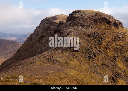 The bealach na Ba isthe third highest road in Scotland and Sgurr a' Chaorachain is a corbett that can easily be climbed from it. Stock Photo