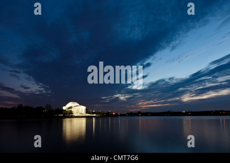 Thomas Jefferson Memorial with reflecting in the Tidal Basin in Washington DC at dusk shortly after sunset with dramatic skies Stock Photo