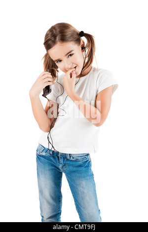 Little girl listen music with a MP3 player, isolated on white Stock Photo