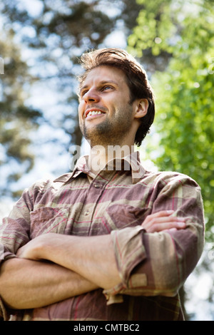 Low angle view of young man smiling Stock Photo
