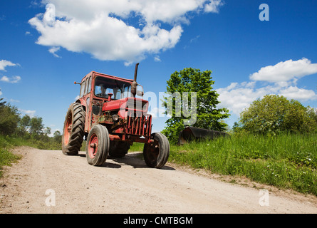 Tractor on country road Stock Photo