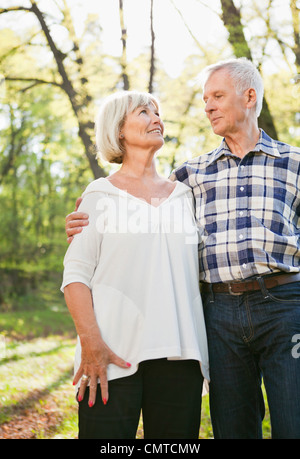 Senior romantic couple in woods Stock Photo