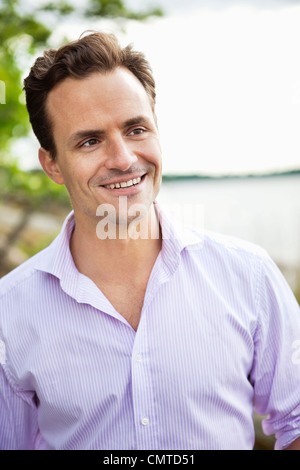 Man wearing shirt looking away Stock Photo