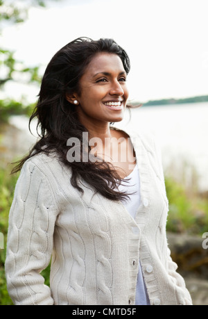 Smiling woman looking away Stock Photo
