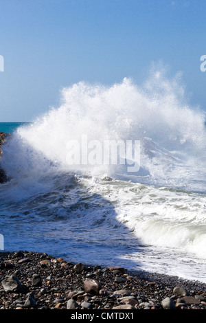 Heavy Atlantic rollers crashing onto rocks on the beach at Ajuy on the west coast of Fuerteventura, Canary Islands Stock Photo