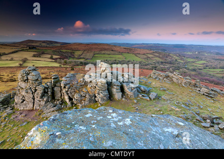 Granite outcrop at Hound Tor, looking over moorland towards Black Hill, Dartmoor National Park, Stock Photo