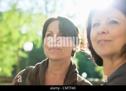 Close-up of smiling woman looking at something Stock Photo