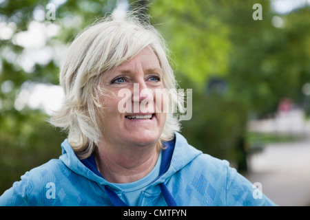 Senior woman looking away and smiling Stock Photo