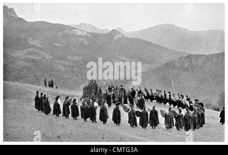 1925 Lamas Red Robes and Yellow Ceremonial Hats special service meadow Muli Stock Photo
