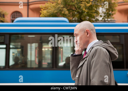 Man using cell phone Stock Photo