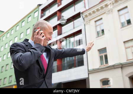 Man on call waving Stock Photo