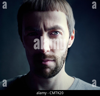 bearded man portrait, lit from the side Stock Photo