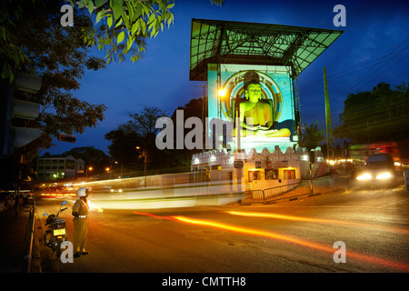 Sri Lanka, Kandy - Buddha statue in the city center, city by night, Sri Lanka, Asia Stock Photo