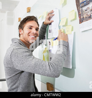 Smiling handsome man looking away Stock Photo