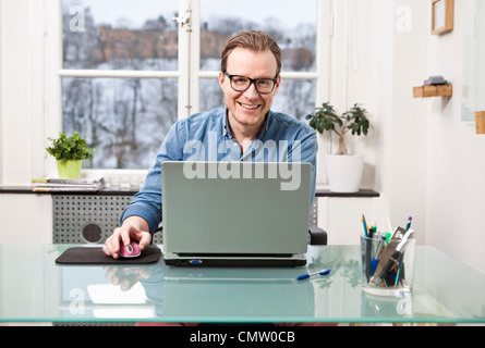 businessman at office using laptop Stock Photo