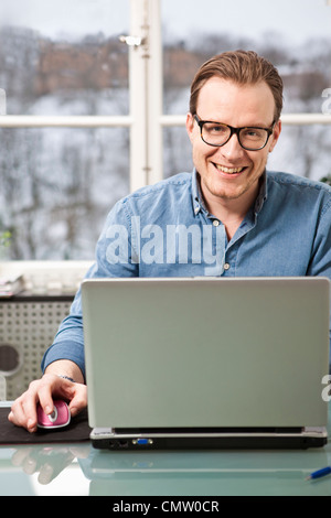 businessman using laptop at workplace Stock Photo