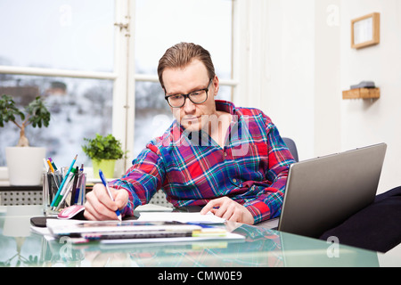 businessman with laptop preparing presentation Stock Photo