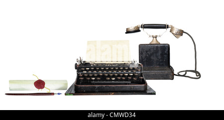 Retro communication tools - Dip pen, typewriter and vintage phone Stock Photo