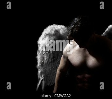 Studio shot of an Angel bowing his head Stock Photo