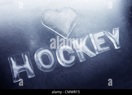 A Heart shape and word 'hockey' made of real ice. Stock Photo