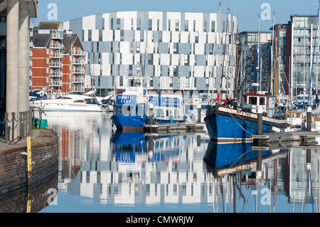 Orwell Lady, Orwell River Cruises, with University Campus Suffolk UCS building to the rear, Ipswich Marina, England. Stock Photo