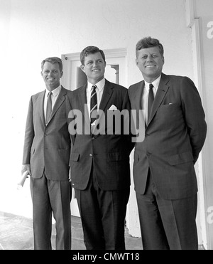 PRESIDENT JOHN F KENNEDY at right with brothers Robert (left) and Edward outside the White House Oval Office on 28 August 1963