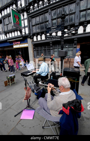 Two street musicians performing jazz music on Forgate street in Chester, Cheshire UK Stock Photo