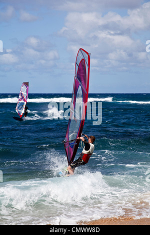 Windsurfer takes off from Hookipa Beach Park on Maui Stock Photo