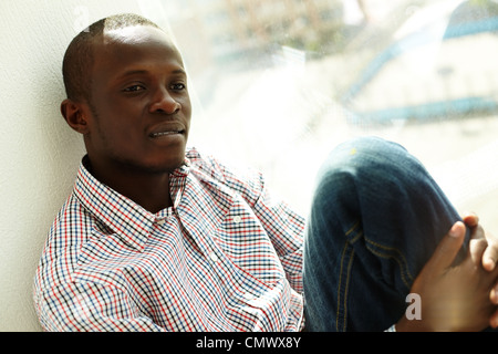 Image of handsome African businessman by the window Stock Photo