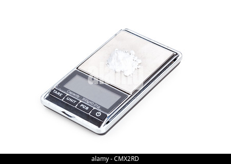 Cocaine on digital scales, closeup on white Stock Photo