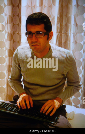Man on keyboard (photographed on computer screen) Stock Photo